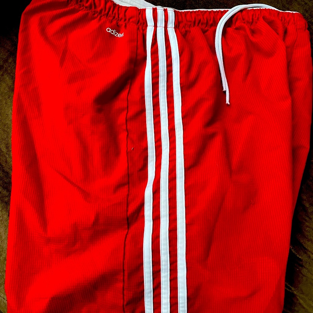 Adidas soccer shorts.   Three stripes